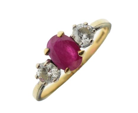 18ct gold, ruby and diamond three-stone ring, the oval cut ruby 5mm x 7mm approx, the two brilliant cuts 4mm diameter approx,