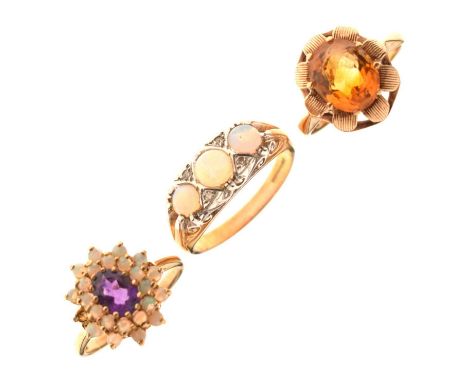 Three 9ct gold gem-set dress rings, comprising a facted oval cut citrine-coloured single stone ring, size N, Birmingam 1970, 