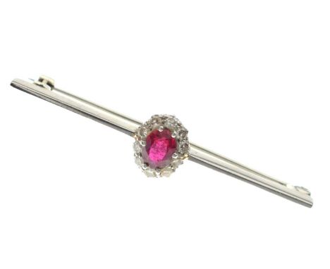 Ruby and diamond bar brooch, the oval cut ruby 4mm x 6mm approx within a border of ten diamonds, unmarked white metal, 4.5cm 