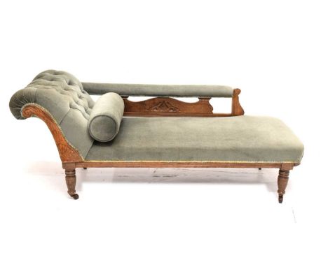 Late 19th/early 20th century button back chaise longue with green upholstery, on four turned supports, raised on castors, 60c