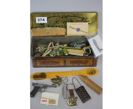 A vintage tin of interesting items.