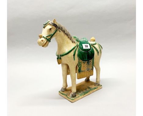 A Chinese Ming dynasty style glazed pottery horse, H. 31cm (old export seal to base).