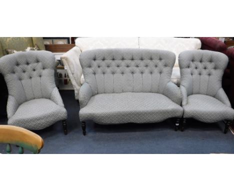 LIBERTY; A SMALL VICTORIAN STYLE THREE PIECE SUITE upholstered in blue material, the sofa, 48" wide