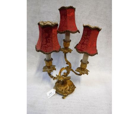 A REGENCY STYLE BRASS THREE BRANCH LAMP BASE with entwined vines