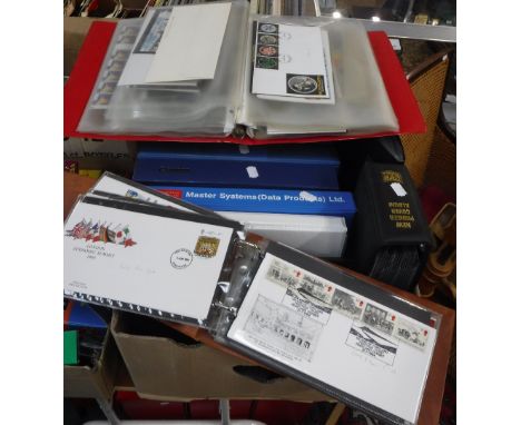 A LARGE COLLECTION OF ALBUMS CONTAINING FIRST DAY COVERS and some unused stamps