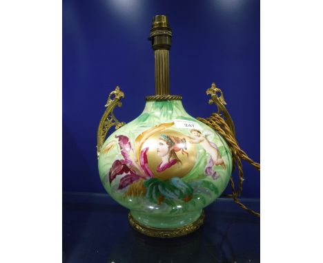 A 19TH CENTURY GREEN GLAZED ELECTRIC TABLE LAMP with a central portrait of a woman, with ormolu mounts