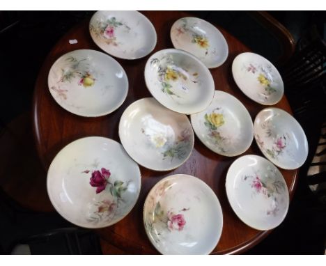 A LATE 19TH CENTURY ROYAL WORCESTER HAND PAINTED PART DESSERT SERVICE, decorated with flowers