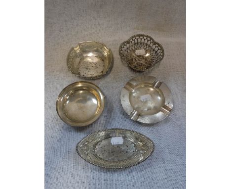 A SILVER BASKET with pierced decoration, two similar, an engine-turned silver ashtray and a circular silver dish