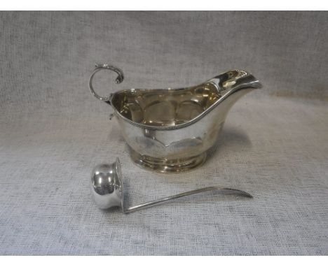 A SILVER SAUCE BOAT, 5.5" long, Birmingham 1926 and a small silver sauce ladle