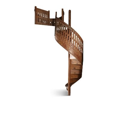 A SPANISH PINE SPIRAL STAIRCASE, 19TH CENTURY, With two sections of additional pine balustrade, 361.95cm high Provenance: Chr