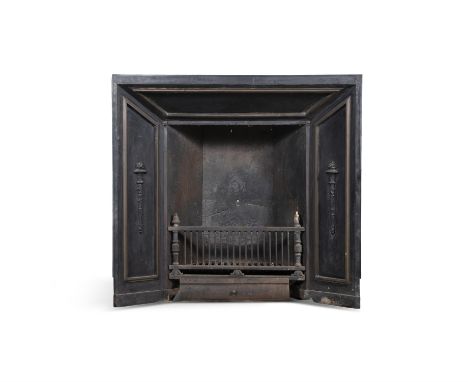 A CAST IRON FIRE GRATE, 19TH CENTURY, with classical Torch designs in relief together with the insert, 134cm high, 112cm wide