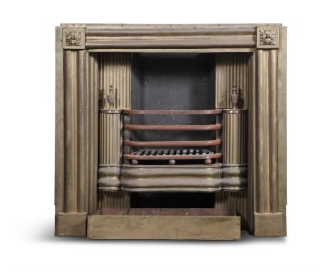 AN IRISH BRASS FIRE REGISTER SURROUND, 19TH CENTURY, with fluted surround, with floral medallions to each corner, with fluted