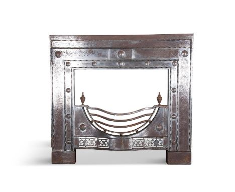 A STEEL FIRE INSERT, 19TH CENTURY, of upright form, with beaded decoration,  floral carved roundels, central section with bow