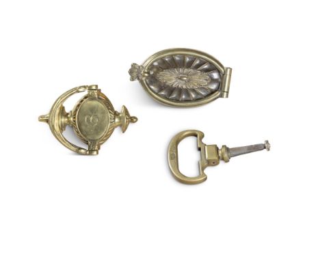 AN OVAL CAST BRASS DOOR KNOCKER, with plain hinged knocker on an oval X X and a hinged pull handle door handle; and a neo-cla