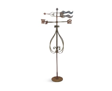 A WROUGHT IRON WEATHER VANE, 19TH CENTURY, with scroll supports and reeded column