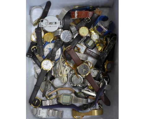 A collection of quartz wristwatches, a stopwatch and a compass 