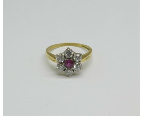 An 18ct gold, ruby and diamond cluster ring, 3.9g, O 