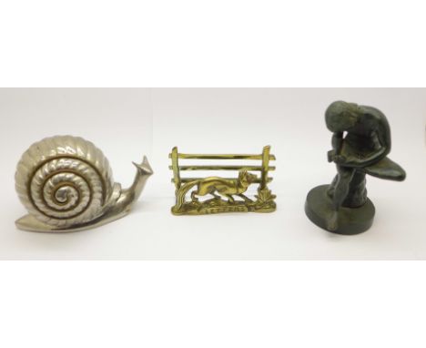 A bronze figure of a girl, a brass letter rack and a metal model of a snail 