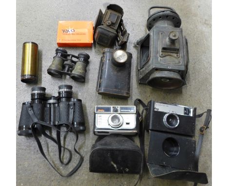 A pair of binoculars, field glasses, cameras, and lamps including a R Broadhurst Dreadnought tail lamp, lacking one glass, ci
