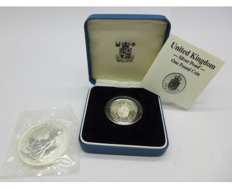 A 1998 One Ounce Fine Silver Britannia £2 coin and a Royal Mint 1988 UK Silver Proof One Pound Coin, with box 