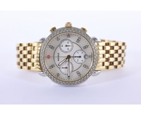 Michele Sidney Diamond Ladies Watch. Retail value is $2,795. Size: 38mm. Stainless Steel & Yellow Plated. Architectural detai