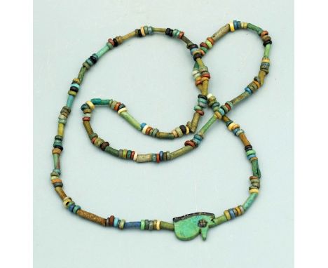 A lovely Egyptian faience bead necklace, Late Period, ca. 664 - 332 BC. It is 20 in. long and is comprised of fine faience tu