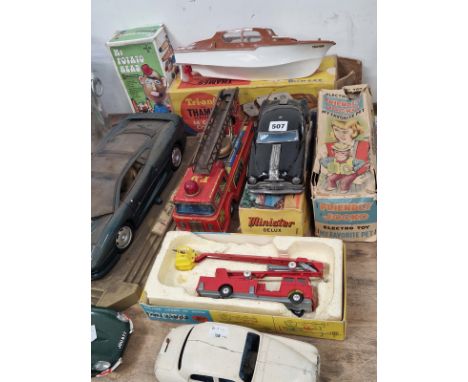 A BATTERY OPERATED CAR, OTHER CARS, A TIN PLATE AND A CORGI FIRE ENGINE TOGETHER WITH A TRIANG CLOCKWORK BOAT