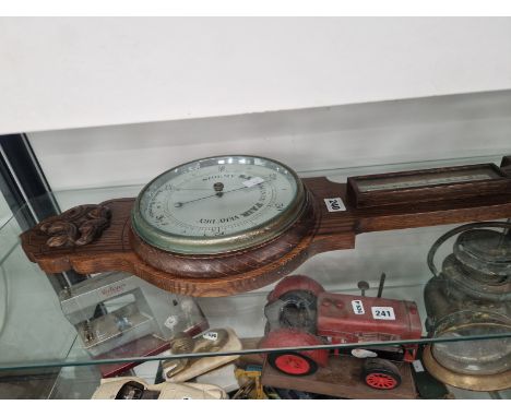 AN OAK CASED ANEROID BANJO BAROMETER WITH A MERCURY THERMOMETER