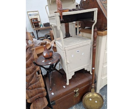 A VINTAGE TIN TRUNK AND A METAL WASHSTAND.