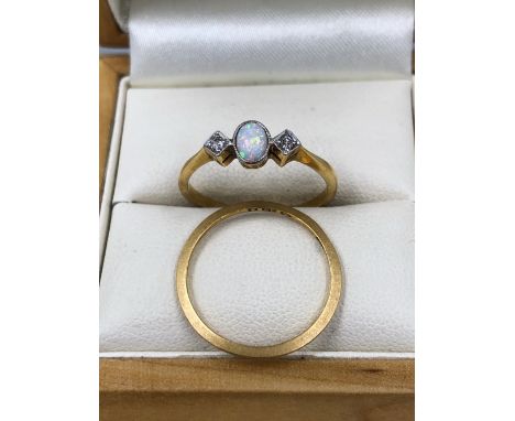 AN 18ct GOLD OPAL AND DIAMOND RING, MARKS RUBBED, SIZE P, TOGETHER WITH A 22ct GOLD WEDDING BAND, SIZE N. 18ct WEIGHT 2.08grm