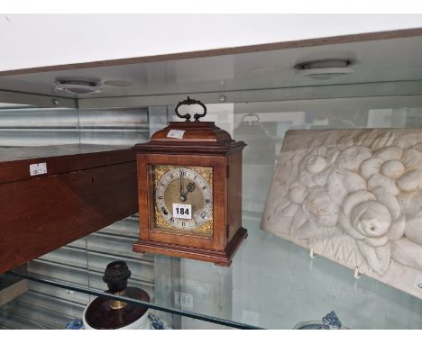 A MAHOGANY CASED STRIKING MANTEL CLOCK, A PLAQUE MOULDED WITH FLOWERS AND A MAHOGANY BOX