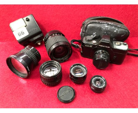 A PENTAX AUTO 110 CAMERA WITH FIVE ADDITIONAL LENSES. 70mm, 20-40mm ZOOM, 50mm, 24mm, 18mm AND A PENTAX FLASH