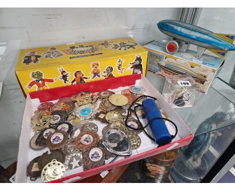 A BOXED PELHAM PUPPET WOLF, ROLLER SCATE AND FOOT BALL MEDALLIONS, A CLOCK WORK ZEPPELIN AND A GIRO TOY TOP