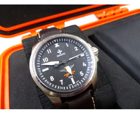 A SAWC WRIST WATCH COMPLETE WITH ORIGINAL HARD ORANGE TRAVEL CASE, WATCH TOOLS, SPARE STRAP, GUARANTEE AND INSTRUCTIONS, APPE