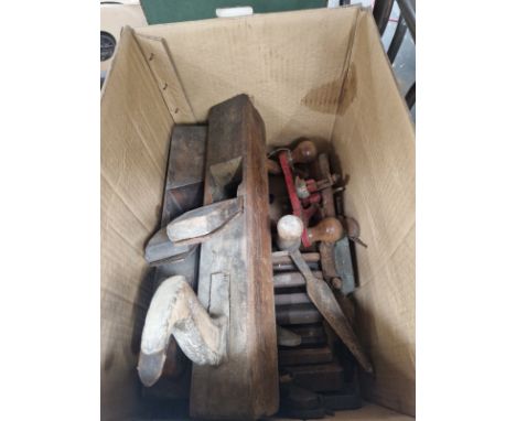 A CARTON OF WOOD WORKING PLANES AND TOOLS