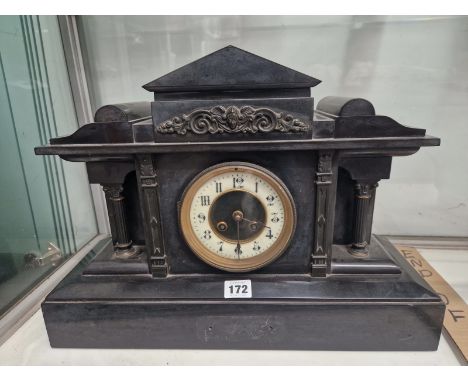 A BLACK SLATE CASED STRIKING MANTEL CLOCK 