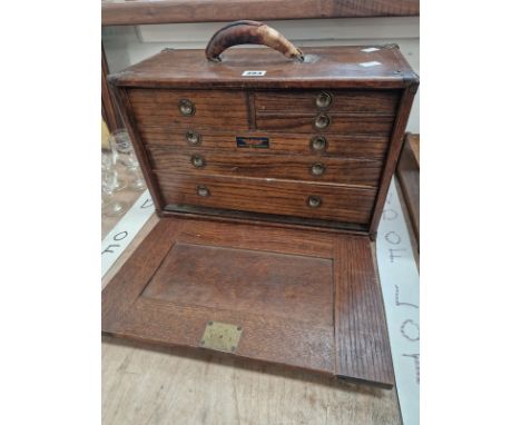 AN OAK UNION CHEST OF SIX DRAWERS CONTAINING CALIPERS AND OTHER TOOLS