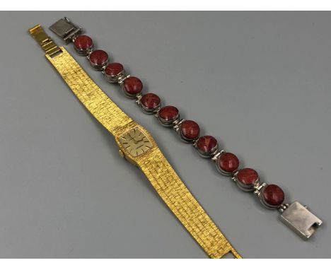 A LADIES REGENCY BRICK STYLE BRACELET MANUAL WOULD WATCH, TOGETHER WITH A UNHALLMARKED SILVER AND POSSIBLY CORAL BRACELET. 