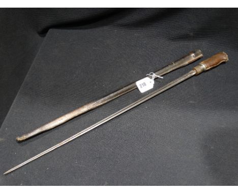     A Leather Swagger Stick Containing Bayonet Blade                                