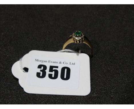     A 9ct Gold Diamond &amp; Emerald Ring                                               