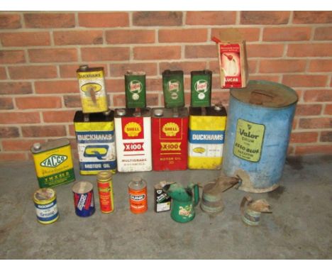 Good Sized Collection of Oil Cans and Jugs including Valor Esso Blue, Shell X‑100, Duckhams and Castrol. This lot is subject 