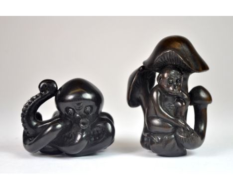 Two signed fruitwood netsuke of an octopus and mushrooms.