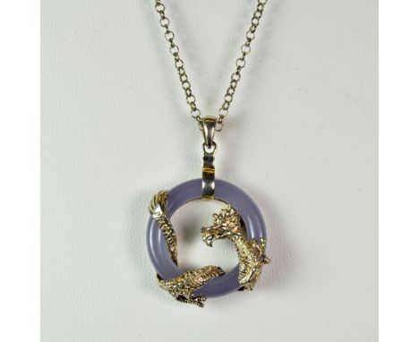 A Chinese lavender jade and silver pendant and chain.