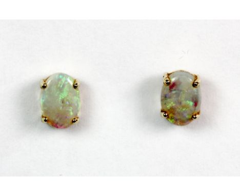 A pair of 9ct gold and opal earrings.