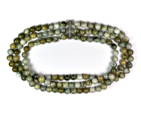 A three row mixed colour jade bead necklace.