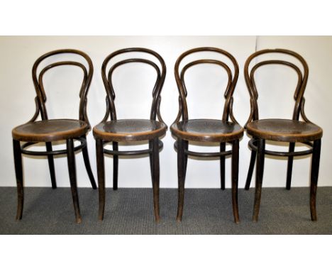 A set of four vintage bentwood cafe chairs.