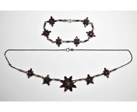 A 925 silver amethyst and marcasite necklace and bracelet.