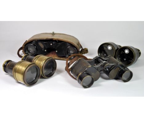 Four pairs of vintage binoculars.