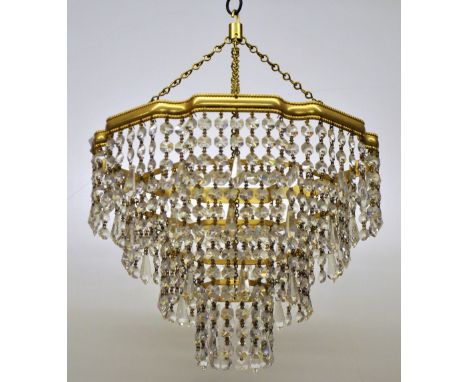 A gilt metal and crystal four tear chandelier light fitting, D. 30 cm.
