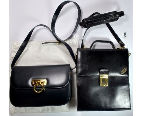 A Vera Pelle vintage leather shoulder bag with a dark blue Volterra Italian leather hand bag.